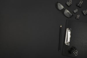 top-view-desk-dark-concept-with-copy-space